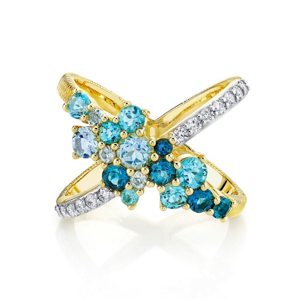 Closeup photo of BLUE TOPAZ CRISS-CROSS RING WITH DIAMOND DETAIL
