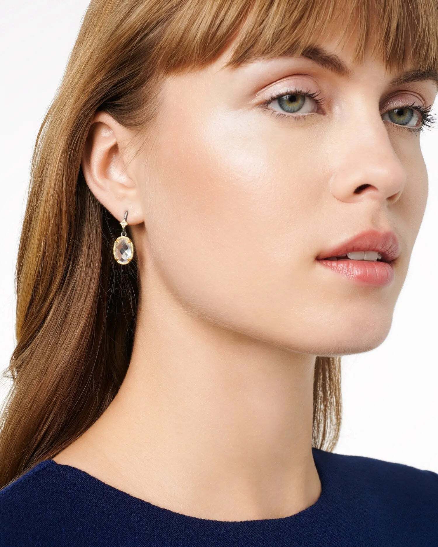 Crafted with a .925 Sterling Silver core for unmatched durability, ensuring your piece stands the test of time.Each clear cubic zirconia stone is meticulously hand-set for exceptional brilliance and shine, showcasing the ultimate in craftsmanship. Available in multiple finishes of our iconic 14K Gold two-tone look. Thoughtfully engraved with the iconic FREIDA ROTHMAN insignia, a symbol of empowerment and refined Brooklyn design. 1 inch lengthLightweight for comfortable and effortless wear. 14K Gold earring post with a large back to provide an easy lift for your ear. Oh So Gorgeous Dangle Earring