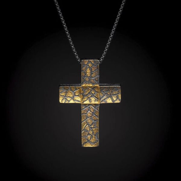 Closeup photo of Rise - Gold Toned Sterling Silver Cross Neckalce