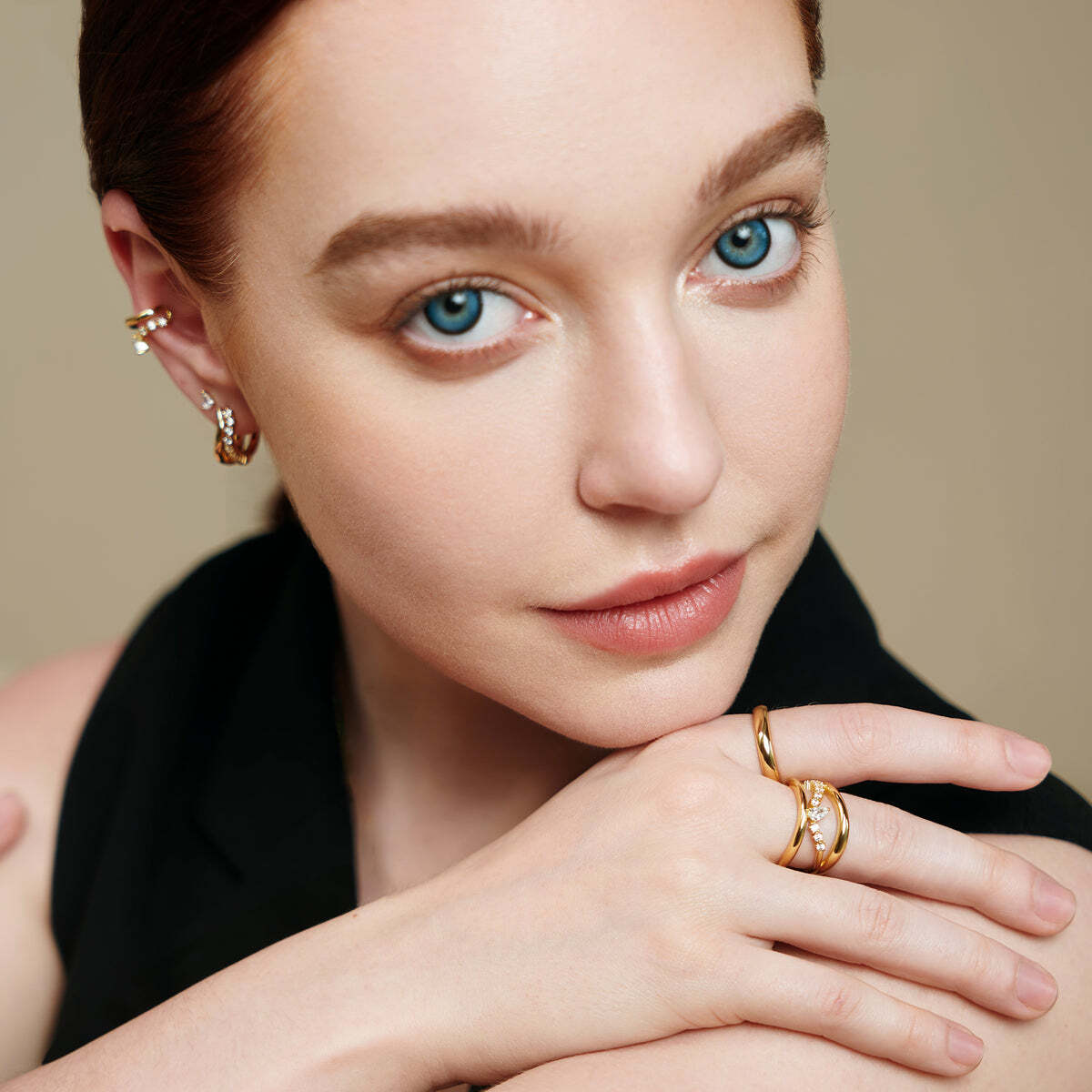 The ultimate ring for the season ahead. This chunky, layered ring features a teardrop-shaped design at the center and is surrounded by a band of cubic zirconias, the combination of polished curves and sparkle make for a ring that will not go unnoticed.Details:Material: sterling silver 14K gold platedDimensions: 17.4mmStone Type: cubic zirconiaStone Size: 1.8mm, 3 x 5mm GOLD SPARKLE RING