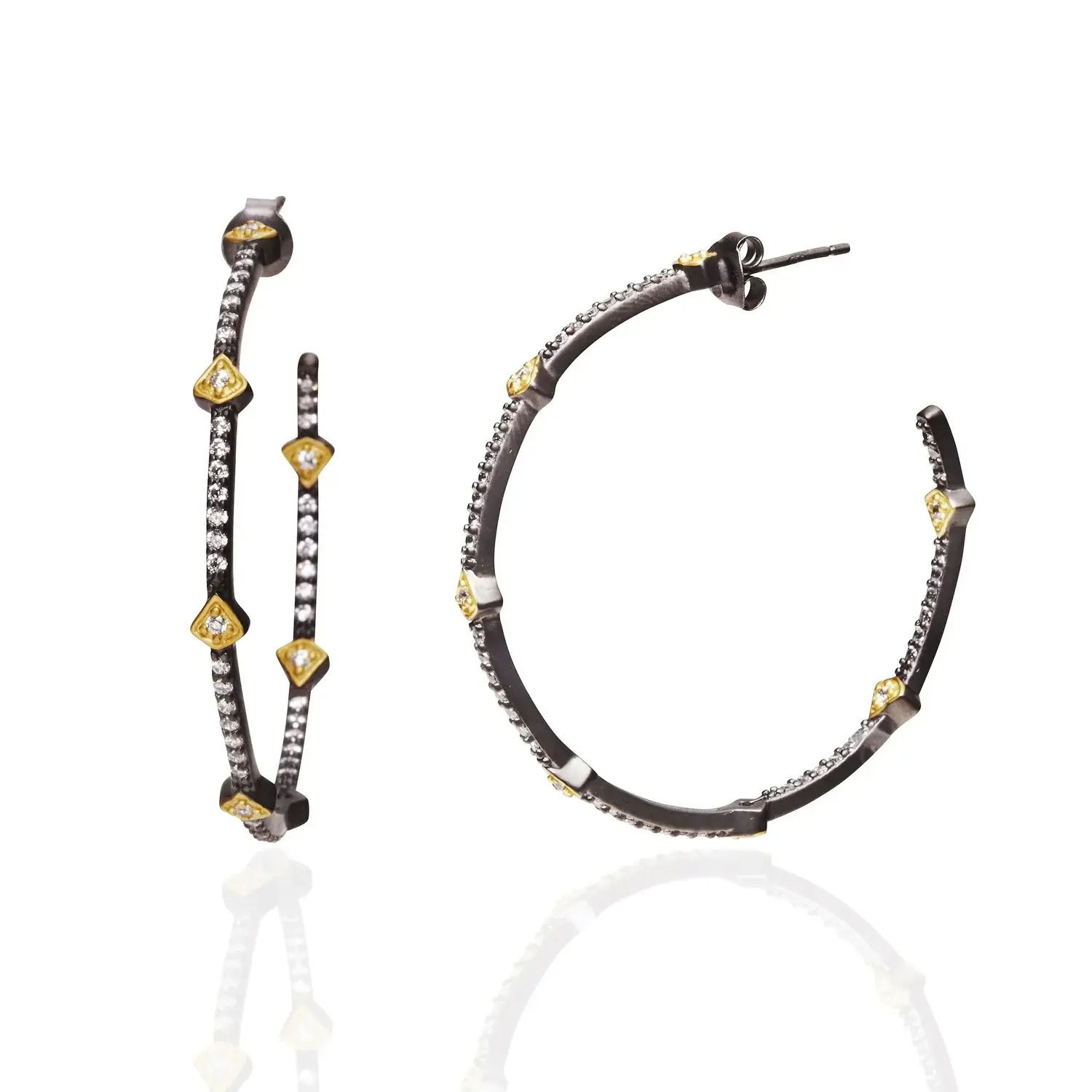 The Best Selling Pavé Arrow Hoop Earrings are everyone's favorite! With pavé work inside and outside of the hoop, along with accents of mixed metal makes these earrings the perfect go to earrings! The scale of these hoops make them our # 1 selling size! 14K gold & rhodium matte finishSterling Silver coreHand-set cubic zirconia stones Hoop earrings Engraved with FREIDA ROTHMAN insignia FREIDA ROTHMAN HOOP EARRING