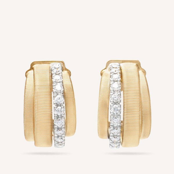 Closeup photo of 18K Yellow Gold Coil and Diamond Huggie Earrings