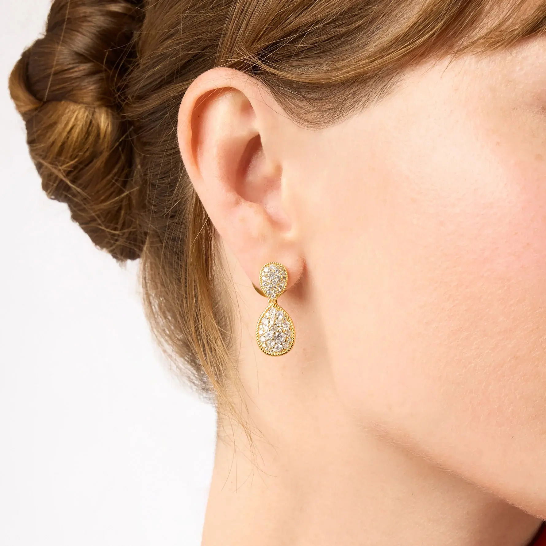 Paired droplets of glittering pavé that swing with every movement. Luna Teardrop Earring