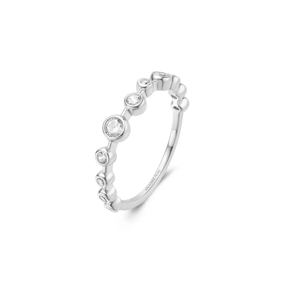 Miss Dainty is designed for the woman who loves elegance with a touch of whimsy. This zig-zag ring is crafted with delicate details, featuring multiple bezel-set cubic zirconia stones. It embodies grace and subtle sophistication, perfect for mixing and matching with other pieces. Ideal for both high-end occasions and everyday wear.Details: Material: sterling silver with rhodium platingSize: 7Stone Type: cubic zirconia SILVER BEZEL ZIG-ZAG RING