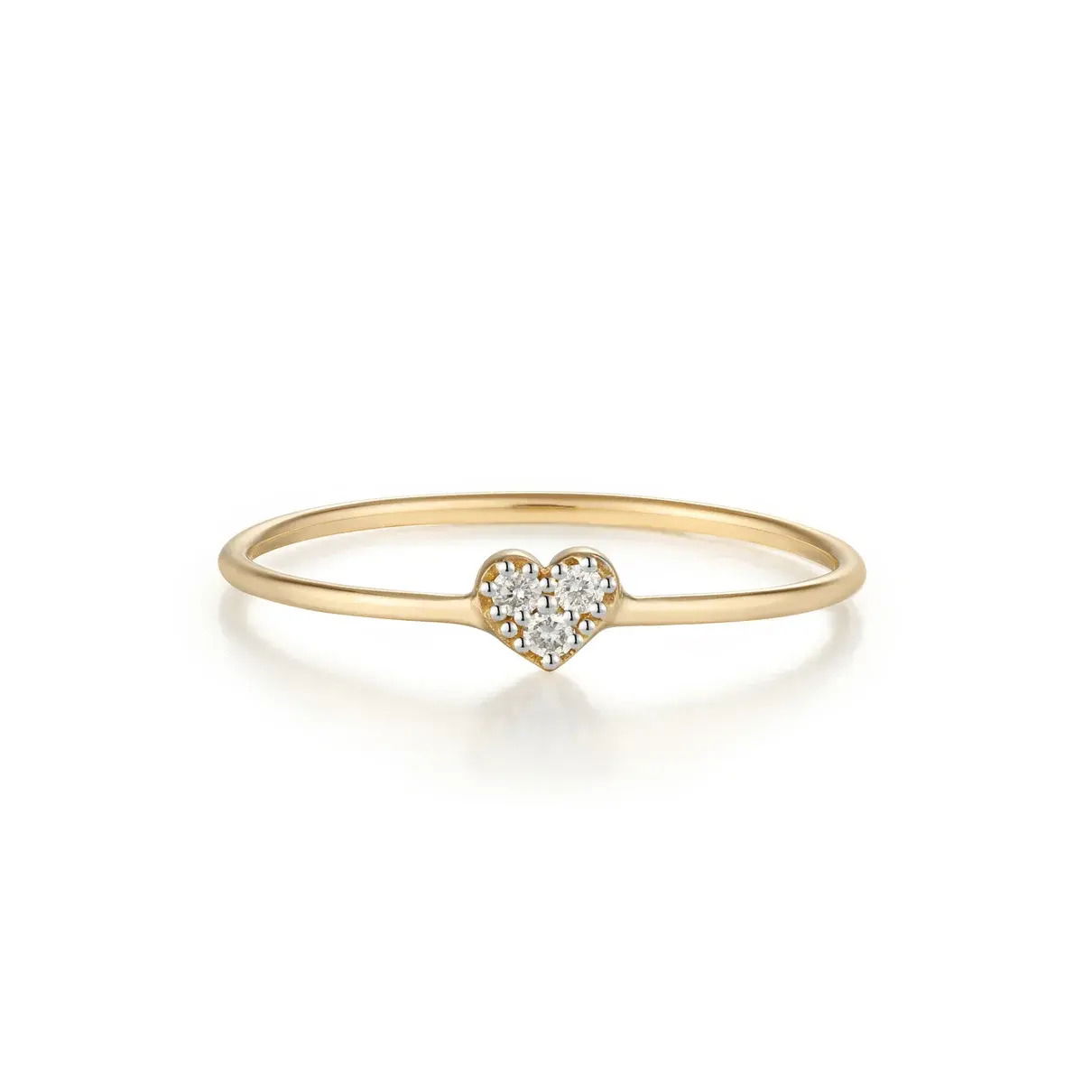Put on the Sophie Diamond Heart Ring to add some glittering romance to your fingers. Featuring three little diamonds in a classic and charming heart design, this is the perfect gift to yourself or someone you hold dear.Details: Material: 14K solid goldSize: 5Stone Type: diamondStone Size: 1.3mmTotal Carat Weight: 0.03ct SOPHIE | DIAMOND HEART RING