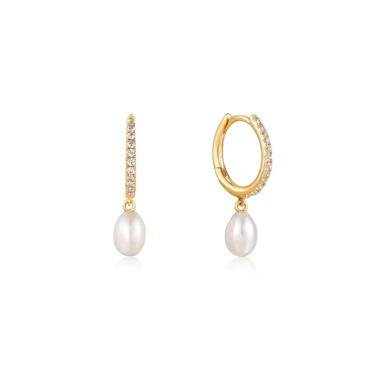 Sparkling white sapphire and a classic pearl come together in this classic yet modern design. This huggie is the perfect addition to your eardrobe.Details: Material: 14kt solid yellow gold Dimensions: 4.5mm x 3.3mmStone Type: pearl and white sapphireStone Size: 1mm, 1.1mm, 4mm - 4.5mmSold: as a pair 14k GOLD PEARL AND WHITE SAPPHIRE HUGGIE HOOP EARRINGS