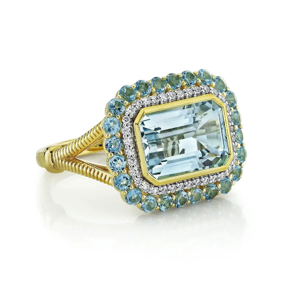 18K Yellow Gold Sky Blue Topaz Ring With Swiss Blue Topaz And Diamond Halo. All sizes available for special order, please reach out to inquire about availability and pricing. SKY BLUE TOPAZ RING WITH SWISS BLUE TOPAZ & DIAMOND HALO & STRIE DETAIL