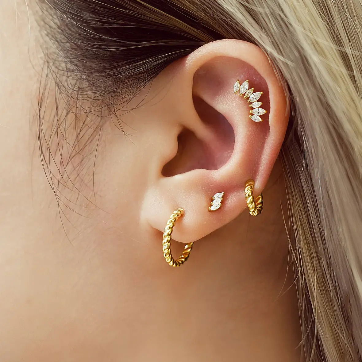 • Material: 925 Sterling Silver with 14kt Gold Plating with Cubic Zirconia• Earring Size: 6.1 x 3.1mm• Weight: 0.6g Gold Triple Marquise Stud Earrings