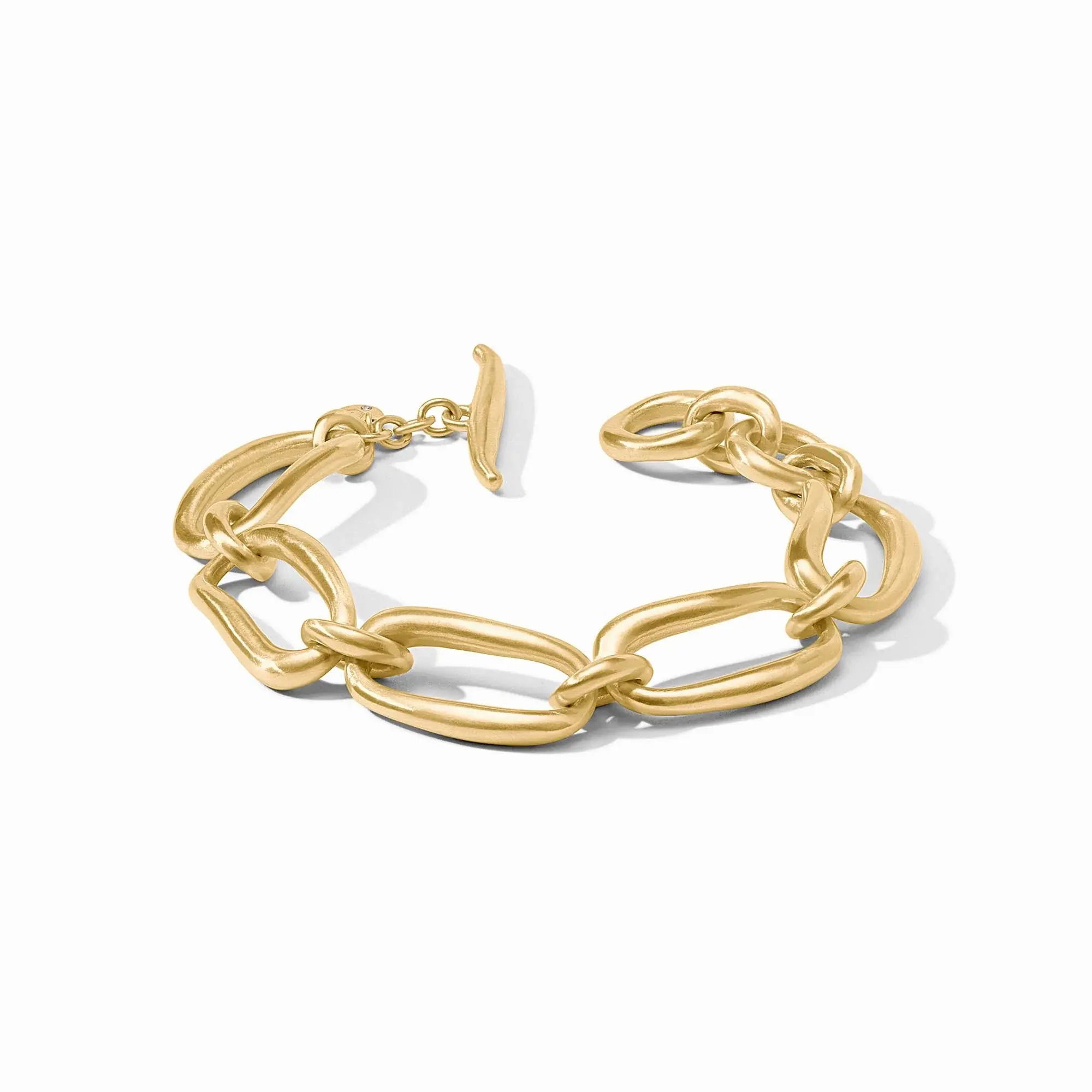 A bracelet of undulating oblong links resembling hand-stretched golden rings, connected by curvaceous loops and featuring an adjustable toggle closure. Wave Link Bracelet