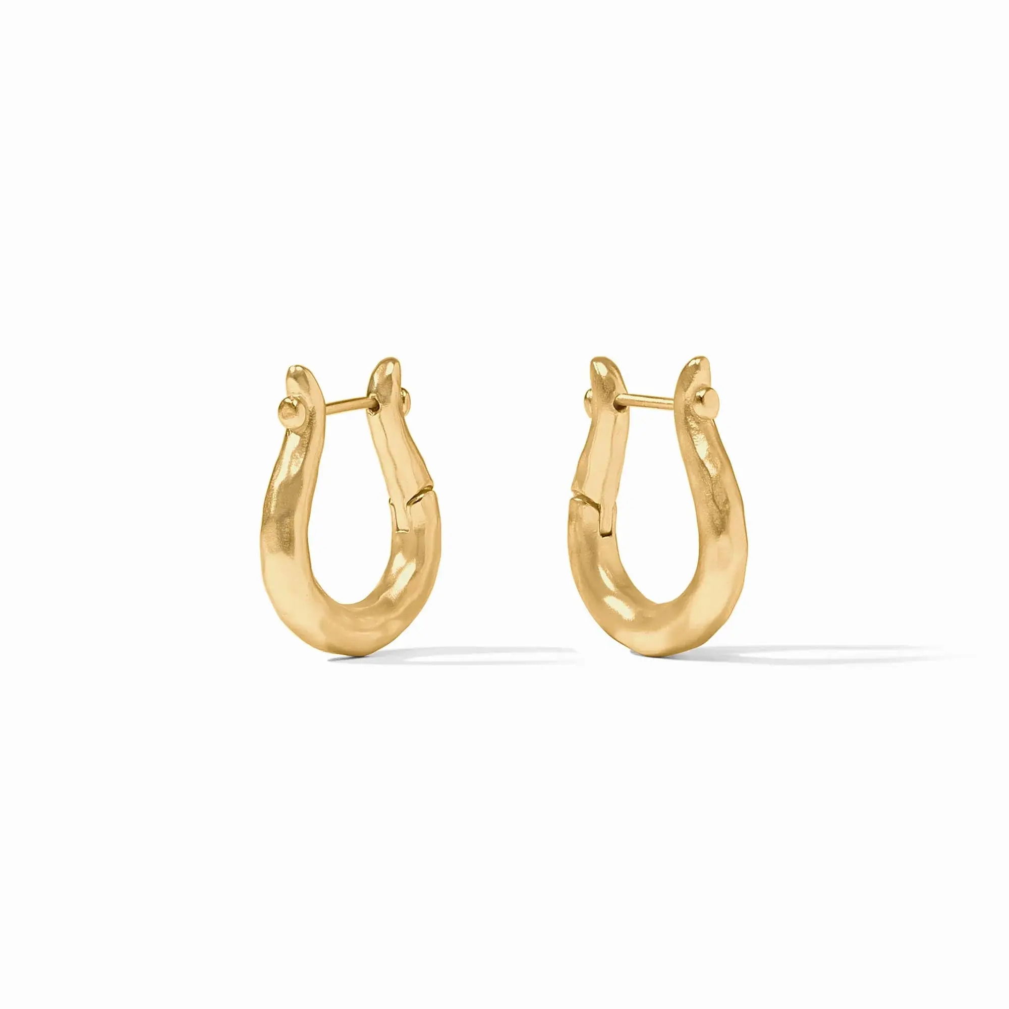 Brimming with timeless equestrian elegance, these lightly hammered golden hoops recall the form of vintage bridle rings. Saratoga Hoop