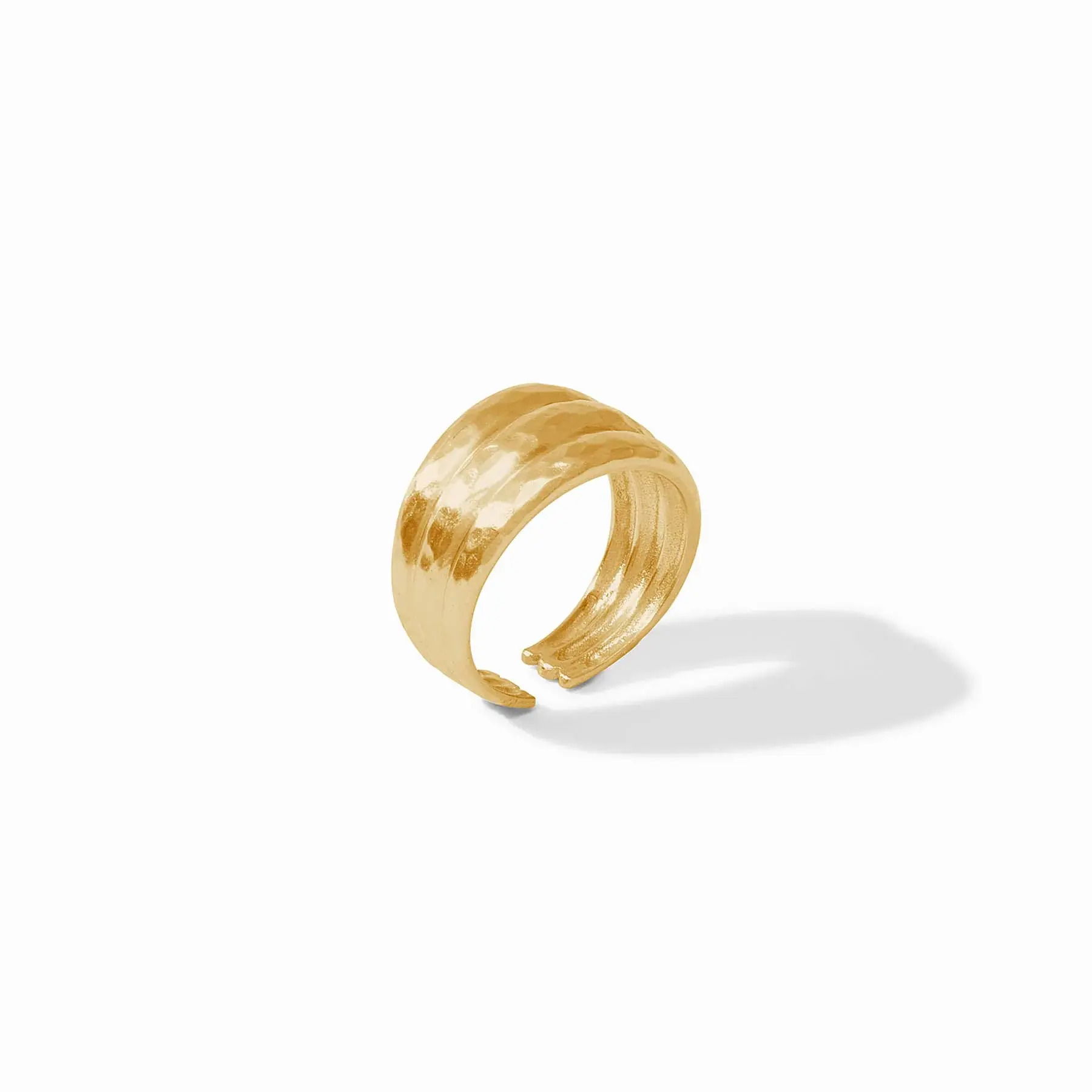A fluted ring crafted from three softly tapering golden bands with a lightly hammered finish. Cirque Ring