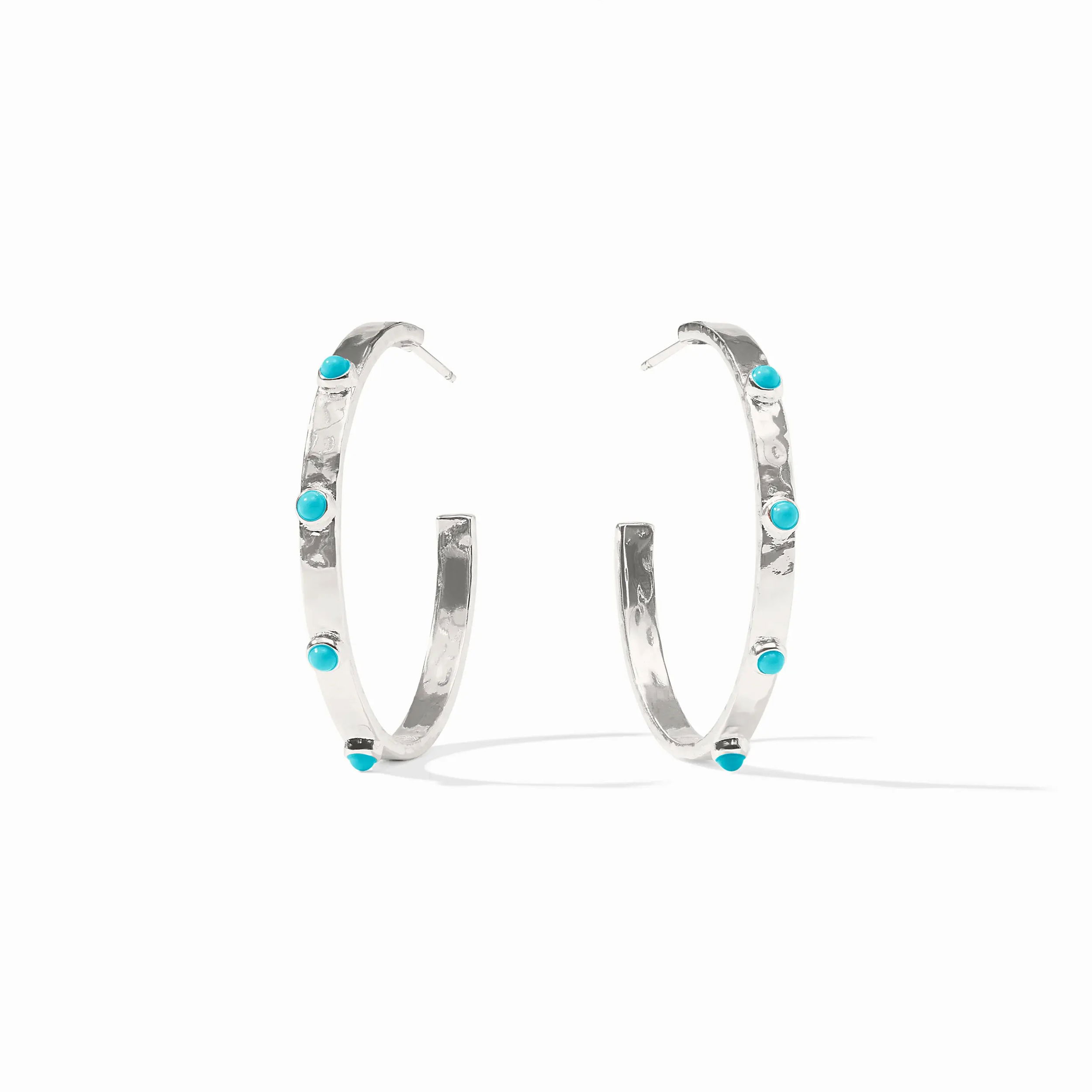 Pure silver plate (tarnish-free), reconstituted stoneLength: 1.3 inches (medium), 1.8 inches (large), 2.1 inches (extra large)Post for pierced earsIncludes pure silver plated earring backs CRESCENT STONE HOOP SILVER - TURQUOISE BLUE