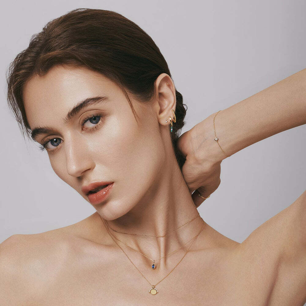 The Paloma necklace showcases a striking marquise-shaped sapphire set in a secure bezel setting. This elegant and sophisticated piece adds a vibrant pop of color, making it a timeless addition to any jewelry collection. Product Details: Material: 14K Solid Gold 16" + 2" ext. Charm Size: 10.5*6.2mm Lab-Grown Sapphire Si PALOMA | Bezel Marquise Lab Grown Sapphire Necklace