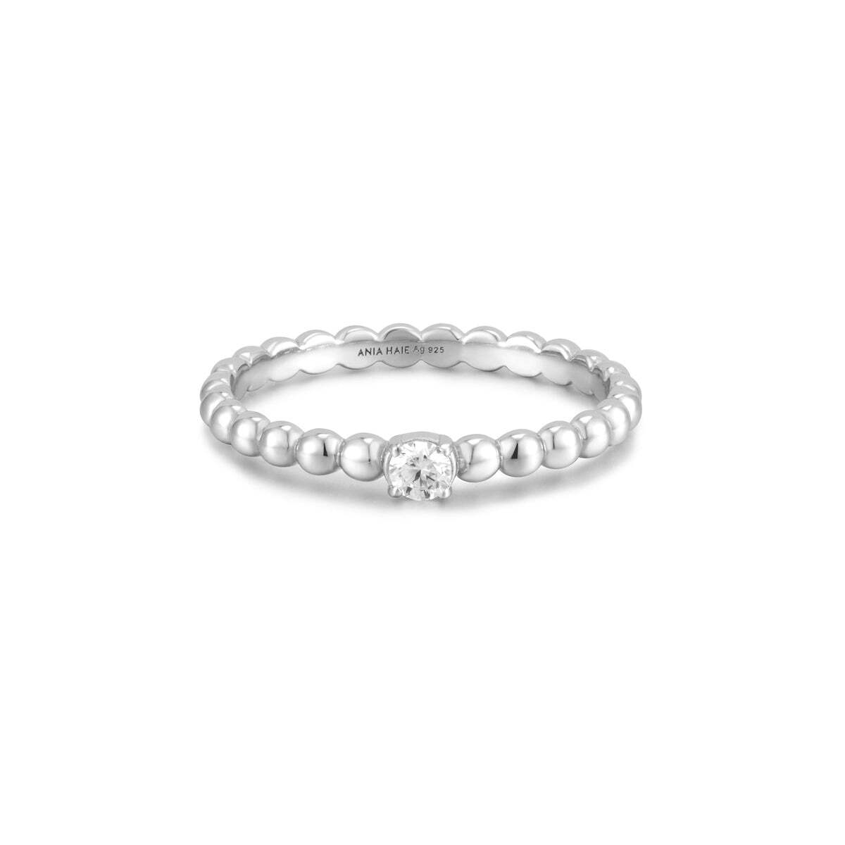 Product Description: You'll definitely fall in love with our adorable plump ring. Made of multiple spheres connected together, this ring features a cubic zirconia stone set in the center of a band in rhodium-plated sterling silver. Stack it up with yours, effortlessly suiting your daily looks. Product Details: • Materi Silver Cubic Zirconia Round Dome Ring– Ania Haie US