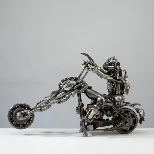 Closeup photo of 14" Predator riding Motorcycle Inspired Recycled Metal Sculpture