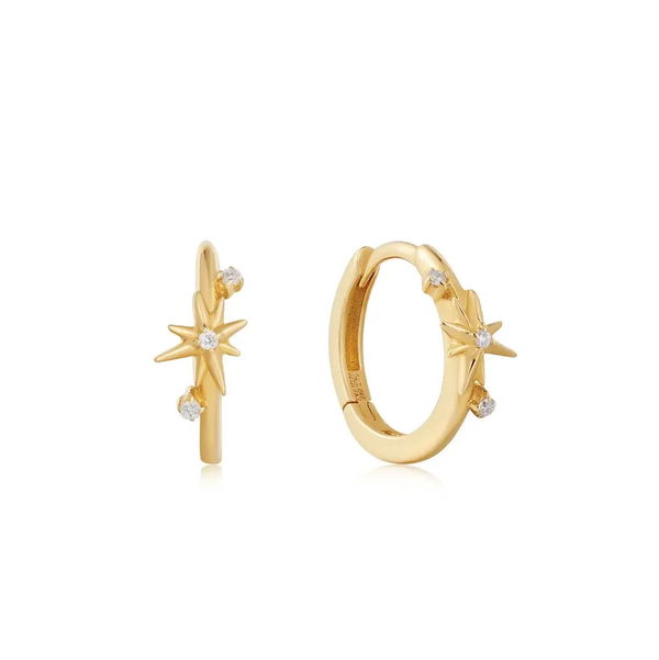 Closeup photo of 14K Gold Diamond Star Huggie Hoop Earrings