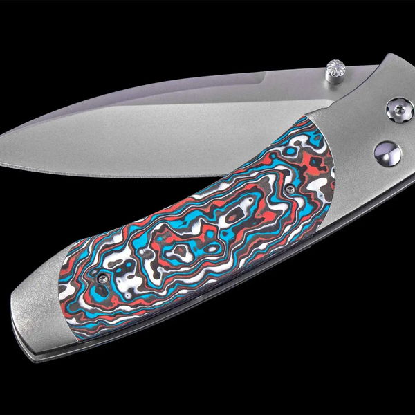 Closeup photo of Titanium pocketknife with stainless blade and colored carbon fiber