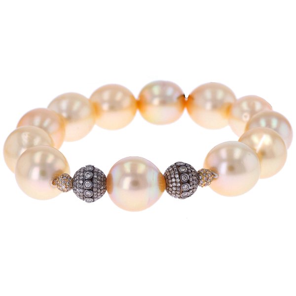 Closeup photo of South Sea Golden Pearl Stretch Bracelet With 14k Diamond Charms