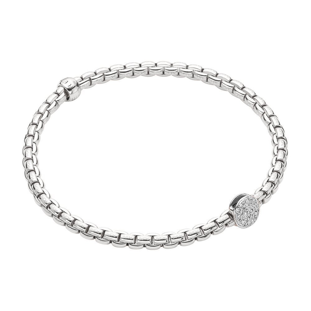 This stunning Eka Tiny Flex'It Bracelet in White Gold with Pave Diamond Disc is perfect for adding a touch of glamour to any outfit. Crafted from 18k yellow gold and set with sparkling white diamonds, this bracelet is sure to become an instant classic piece. The flexible design and size XL (19cm) make it easy to layer with other jewelry or wear alone for an eye-catching look. Make a statement the Eka Tiny Flex'It Bracelet in Yellow Gold with Pave Diamond Disc. Eka Tiny Flex'It Bracelet in White Gold w/ Pave Diamond Disc - Size XL (19cm)
