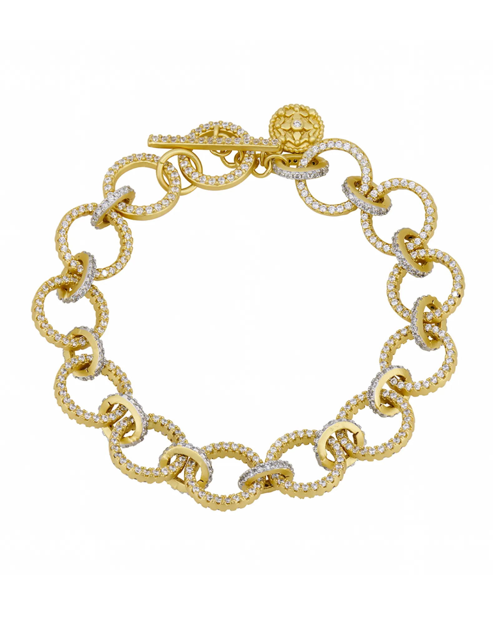 Armed for a new season of hope, the Chains of Armor Link Bracelet is symbolic of the grit and steel of Brooklyn and adorned with scintillating sparkle. This edgy style features luminous matte gold and intricate pavé detail. Add edge to your layered look with this chain link style.14K gold & rhodium matte finishSterling silver coreHand-set cubic zirconia stones18", toggle clasp Engraved with FREIDA ROTHMAN insignia Chains Of Armor Link Bracelet