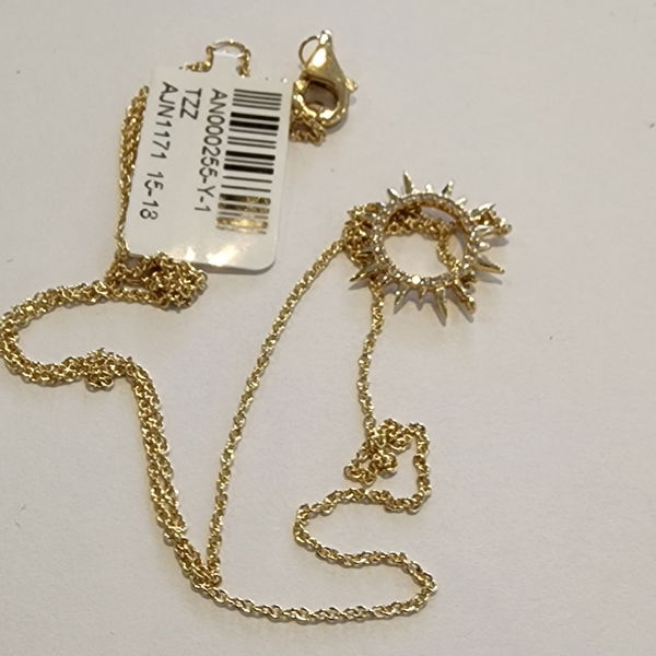 Closeup photo of 14k Yellow Gold Pave Diamond Open Sunburst Layering Pendant Necklace