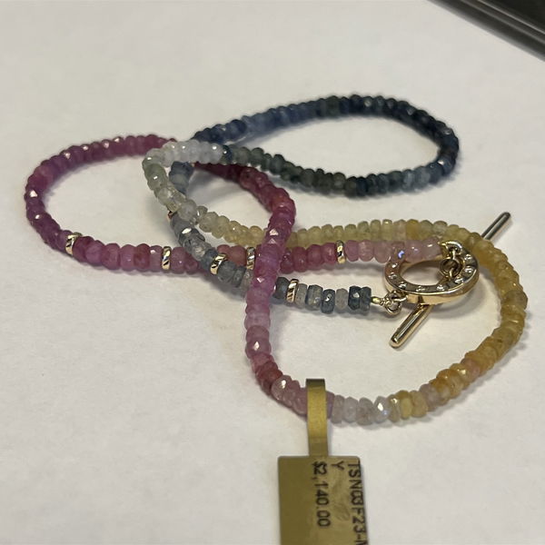 Closeup photo of Ombre Sapphire Toggle Chain With Gold Beads