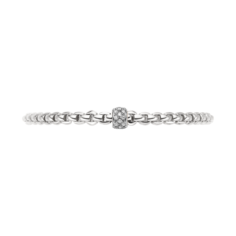 Flex'It White Gold Bracelet with diamonds size S (17 cm). Also called The Solo Collection, it is crafted in the Italian city of Vicenza, and recognizable worldwide. Accented by a beautiful rondel of diamonds totaling 0.01tcw. Crafted entirely in 18K gold and rendered fully flexible. These stunning easy-to-wear bracelets do not need clasps as they easily roll onto your wrists. There are several Flex'It collections and are all available with matching necklaces, earrings, and rings in various gold colors. Easy to wear, lightweight, and complements any outfit.To find your size, measure the circumference of your wrist using a flexible material such as a piece of thread or a strip of paper, and measure it against a ruler. Choose the corresponding size based in centimeters. To convert inches to centimeters, multiply the measurement of inches by 2.54. Eka Tiny Flex'it Bracelet in White Gold with Diamonds - Size S (17 cm)